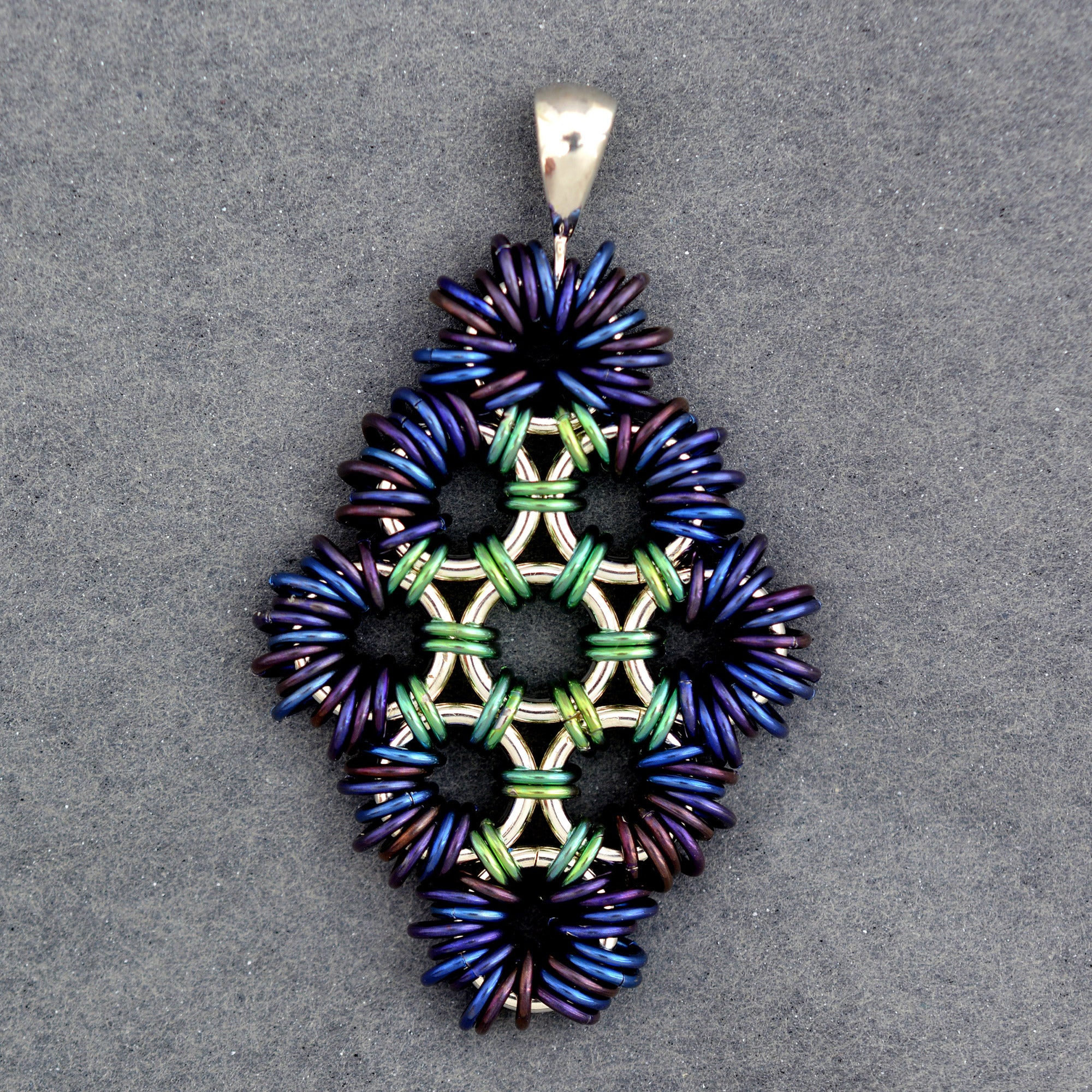 SALE: Coiled Japanese Diamond Pendant in Sterling Silver and Niobium