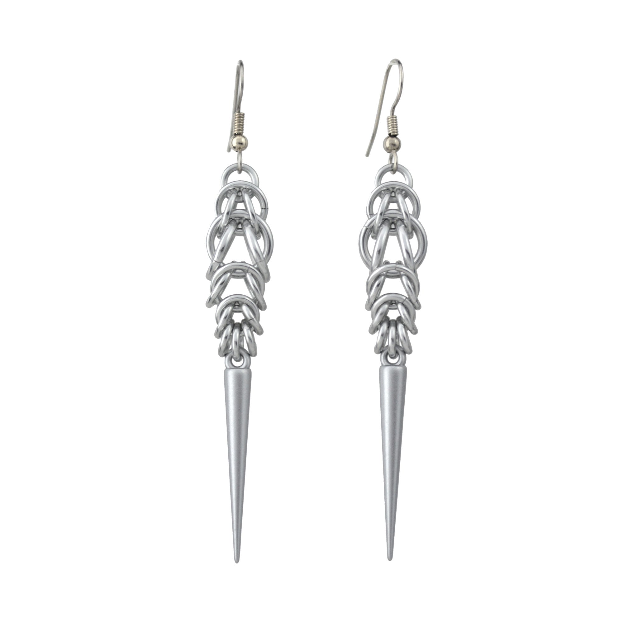 Long, silver color chainmaille earrings in a drop shape, with a long silver spike at the base. The earrings are Persian 6-in-1 weave at the top, transitioning to Box Weave.
