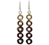 Chainmaille earrings of 5 linked "knots" hanging from the earwire on white background. Top knot is champagne transitioning as you move down the earring to brown and dark brown.