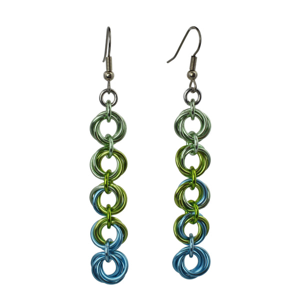 Chainmaille earrings of 5 linked "knots" hanging from the earwire. Top knot is pastel green, transitioning as you move down the earring to chartreuse and light blue. chainmaille earrings by Rebeca Mojica