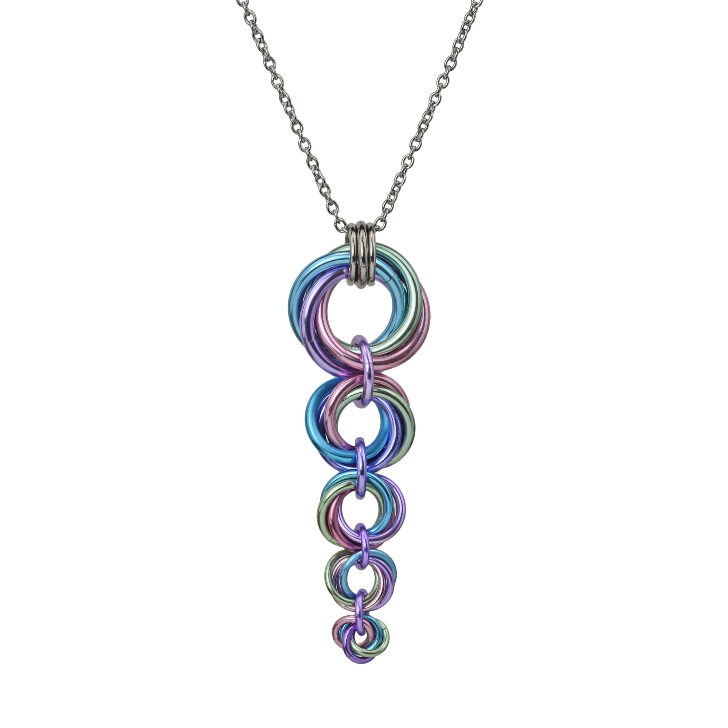 closeup of pastel colored unicorn horn made out of chainmaille, against a white background