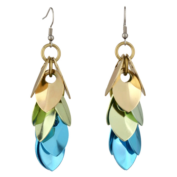 A pair of scalemaille earrings in the Seashell colorway (champagne, seafoam, and light blue) is shown on a pure white background, highlighting the details of each individual scale.