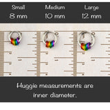Measurement of the inner diameter of rainbow pride huggie earrings in small 8mm, medium 10mm, and large 12mm using a ruler, with text "Huggie measurements are inner diameter."