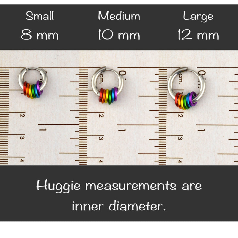 Measurement of the inner diameter of rainbow pride huggie earrings in small 8mm, medium 10mm, and large 12mm using a ruler, with text "Huggie measurements are inner diameter."
