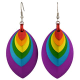 A pair of vibrant rainbow-colored stacked leaf earrings with stainless steel fishhook ear wires, displayed against a plain white background. The leaves are red, orange, yellow, green, blue, and purple, nested from smallest to largest with purple as the largest outermost leaf.