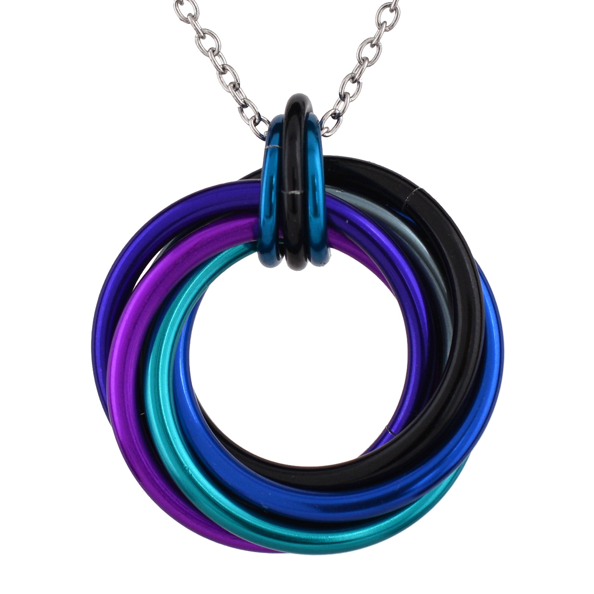 Close-up of the Swirl Pendant featuring black, blue, teal, purple, violet and grey rings on a surgical stainless steel chain against a white background.