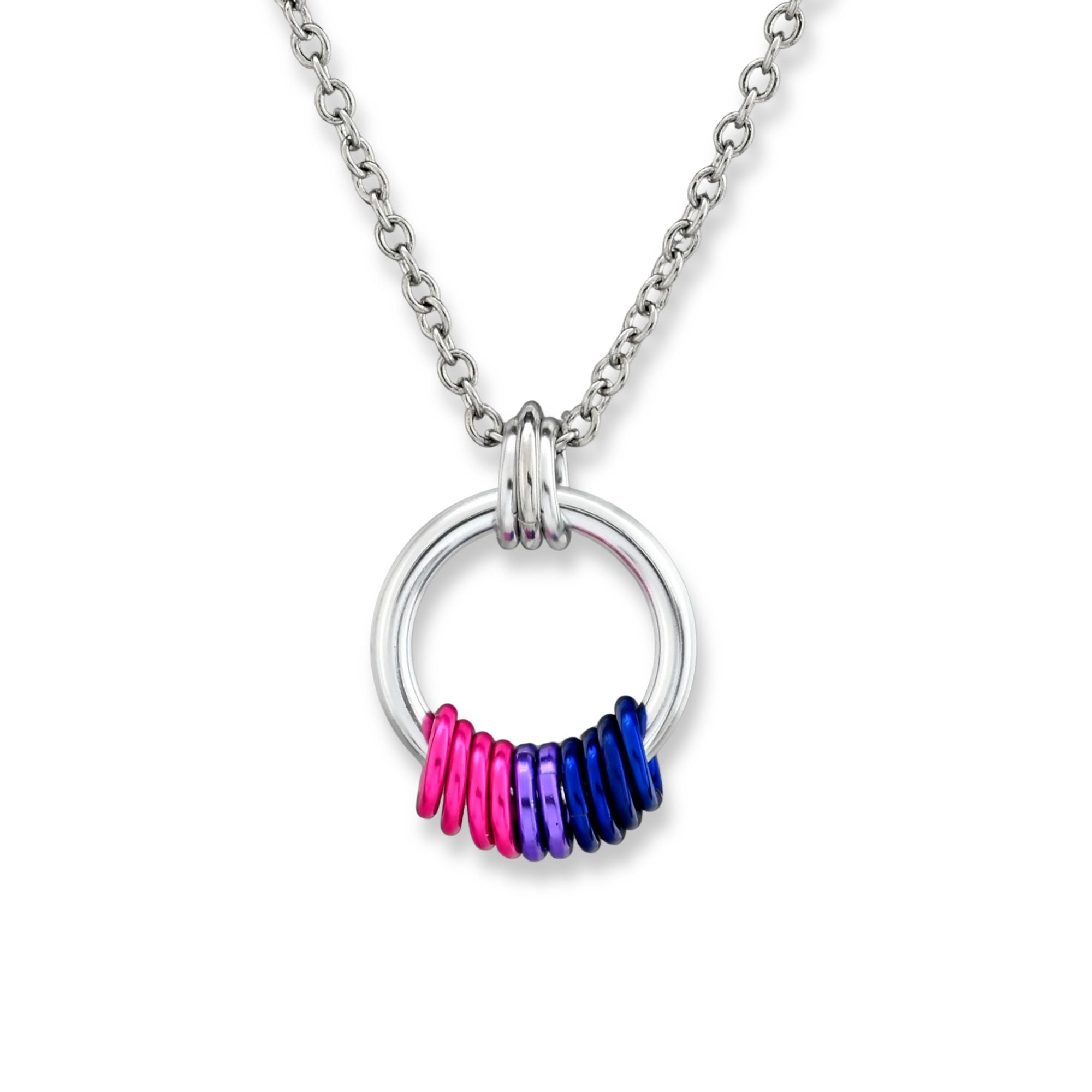 A silver-tone ring pendant on a white background with a cluster of free-spinning rings in Bisexual Pride colors: deep pink, purple, and royal blue.