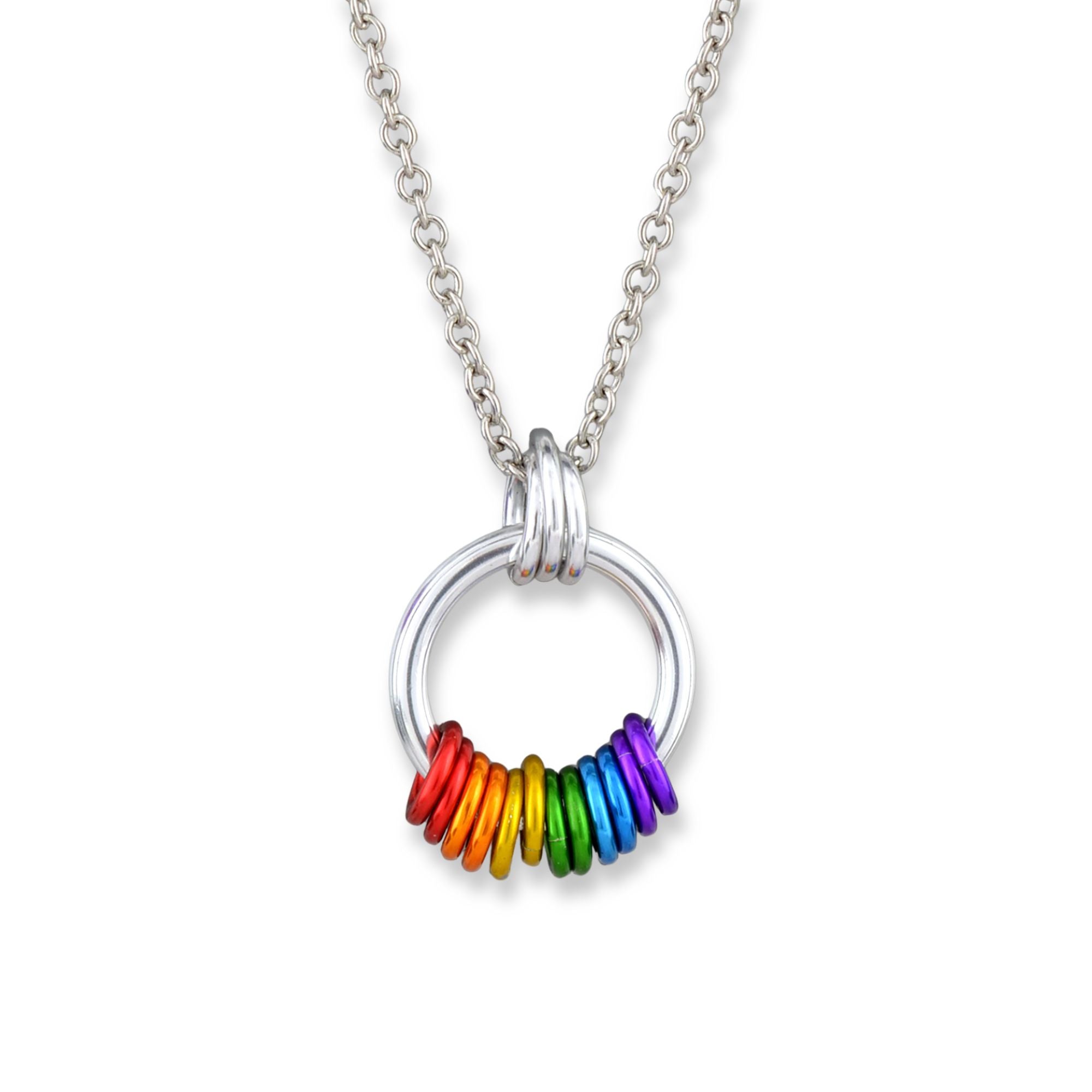 Closeup of the rainbow pride coiled pendant on a white background. A chunky silver loop hangs from a trio of smaller silver links. At the bottom of the loop are 12 vibrant links in the color of the lgbtq rainbow pride flag, from left to right: 2 each red, orange, yellow, green, blue, and violet.