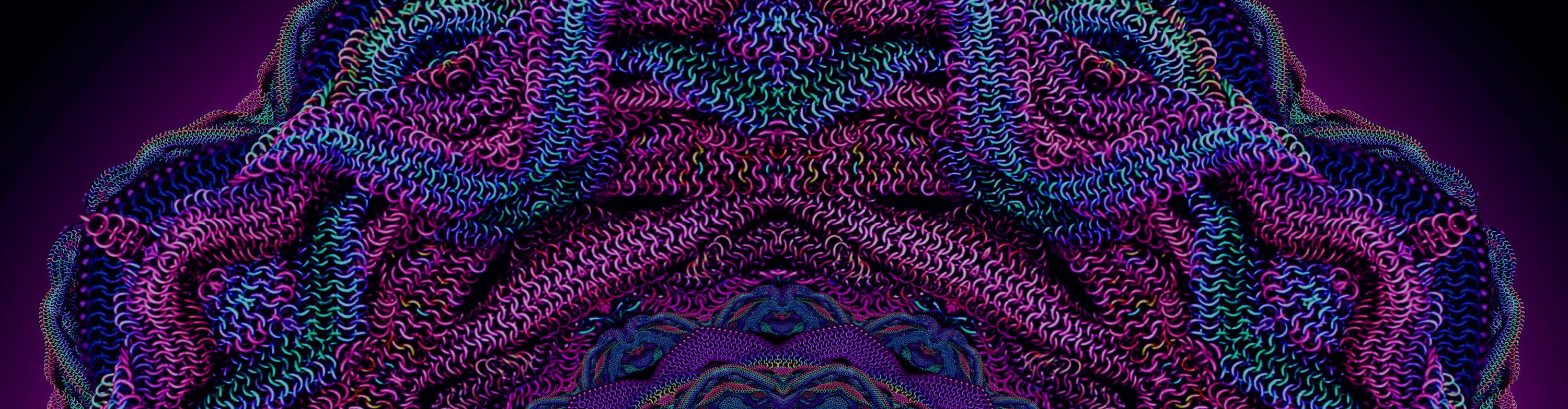 Colorful woven chainmaille pattern with a dark purple background