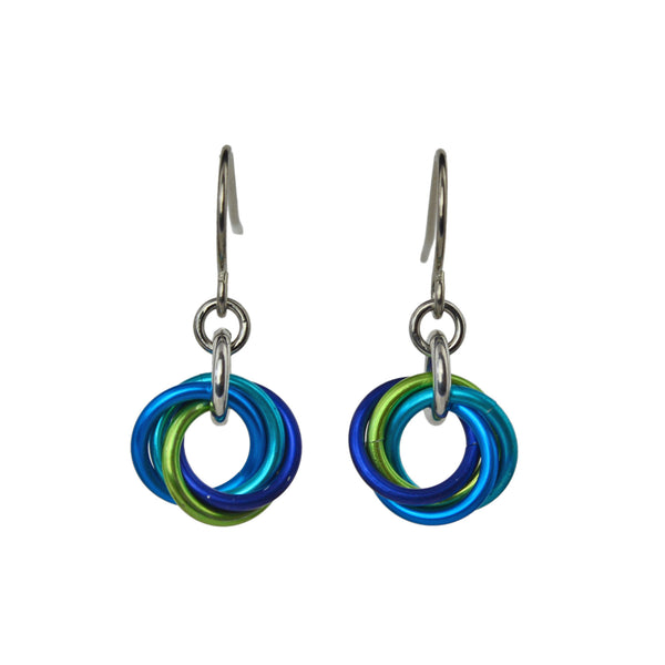 closeup of Minimalist chainmaille earrings in turquoise, blue and chartreuse on white background