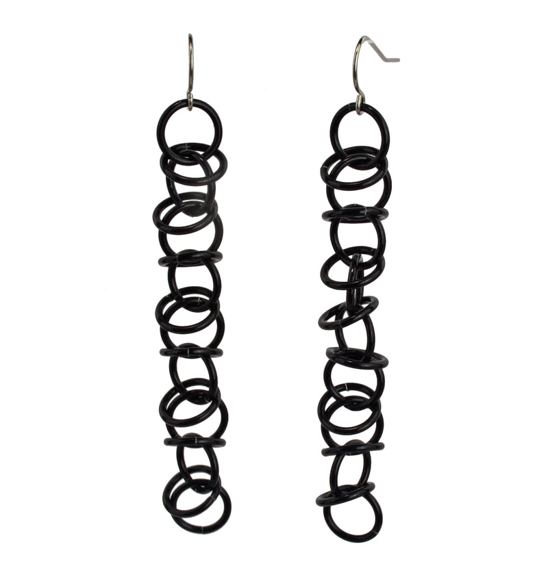 Another view of the chainmaille Long Orbital Black earrings by Rebeca Mojica.