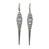 Long, silver color chainmaille earrings in a drop shape, with a long silver spike at the base. The earrings are Persian 6-in-1 weave at the top, transitioning to Box Weave.
